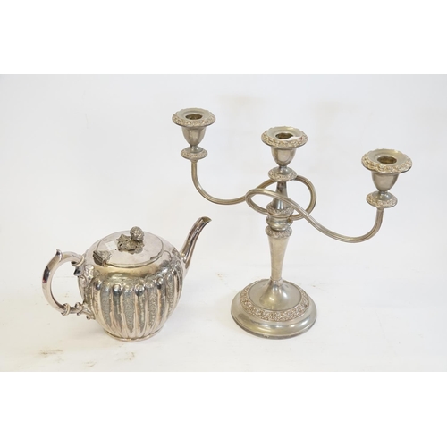 87 - A Silver Plated Teapot and a Candelabra.