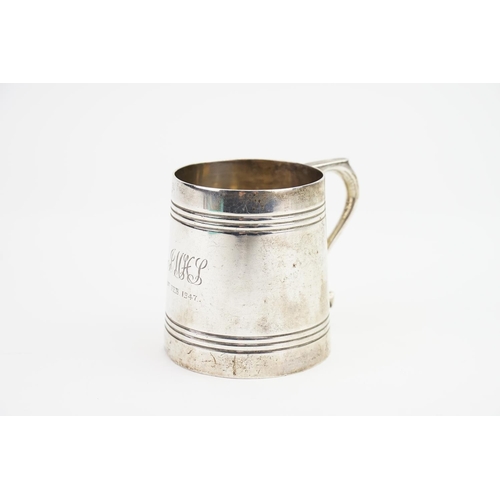 63 - A Child's Silver Can with ribbed decoration. Weighing: 154 grams.