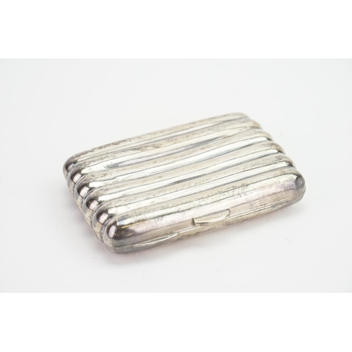 66 - A Ladies Silver ribbed & shaped Cigarette Case. Weighing: 69 Grams.