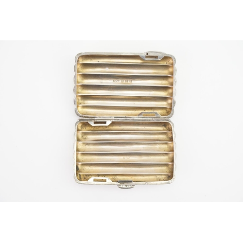 66 - A Ladies Silver ribbed & shaped Cigarette Case. Weighing: 69 Grams.