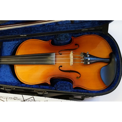 329 - A Modern Violin with an ebony board along with music stand, sheets & Case.