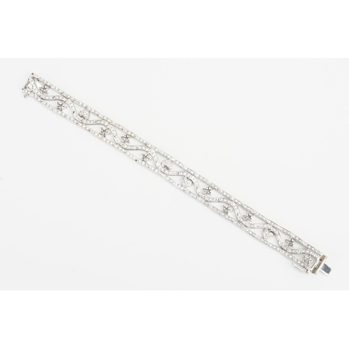 105 - A Lovely 18ct White Gold Diamond Bracelet set with love hearts & Stars. Measuring: 18cms Long. Weigh... 