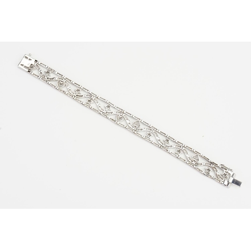 105 - A Lovely 18ct White Gold Diamond Bracelet set with love hearts & Stars. Measuring: 18cms Long. Weigh... 