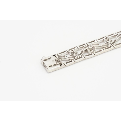 105 - A Lovely 18ct White Gold Diamond Bracelet set with love hearts & Stars. Measuring: 18cms Long. Weigh... 