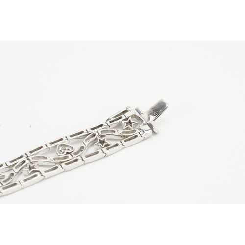 105 - A Lovely 18ct White Gold Diamond Bracelet set with love hearts & Stars. Measuring: 18cms Long. Weigh... 