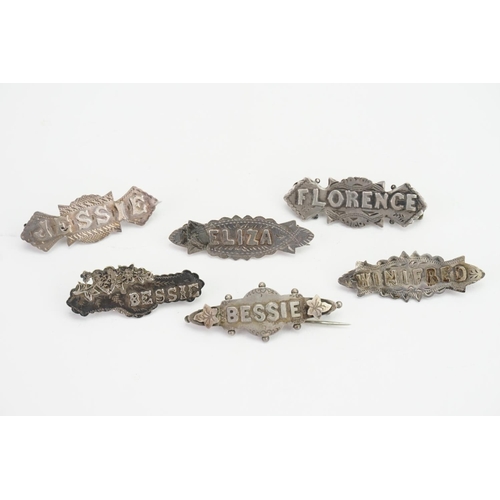 111 - A collection of Six Victorian Silver name brooches to include Florence, two Bessie's, Jessie, Winifr... 