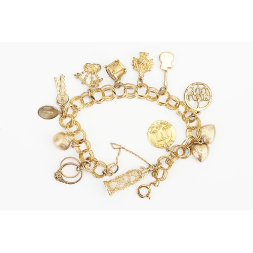 121 - A Gold mounted Charm Bracelet hung with various charms to include Drum, Guitar, Heart, Champagne Bot... 