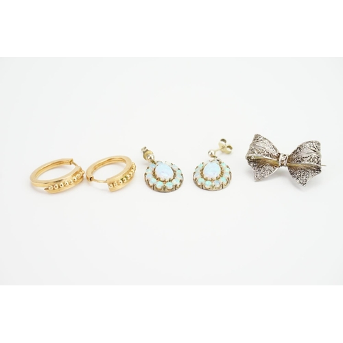 139 - A pair of Gold hoop earrings, along with a pair of Opal earrings and a Silver brooch.