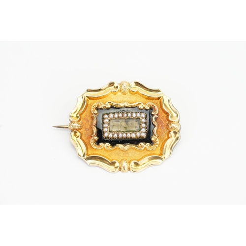 149 - A Gold and Onyx set mourning brooch, pearl set. Weighing: 9.4gms.