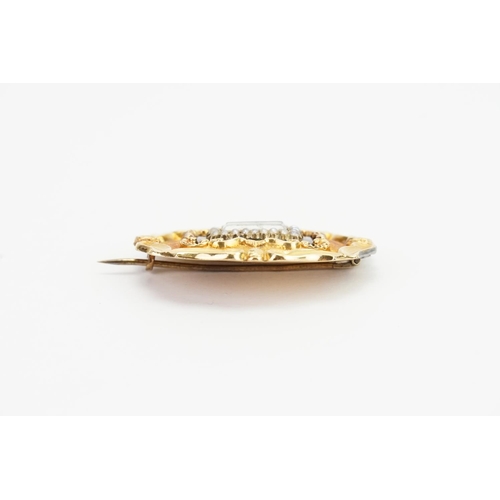 149 - A Gold and Onyx set mourning brooch, pearl set. Weighing: 9.4gms.