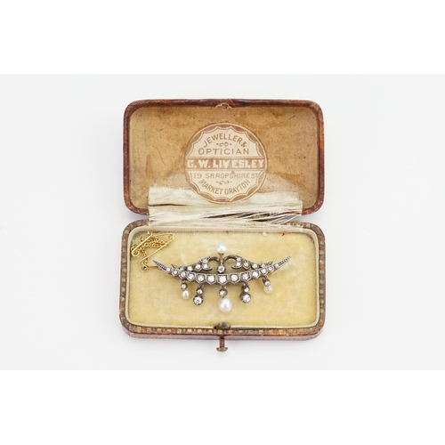 151 - A Victorian 9ct Gold and Silver topped brooch with 31 diamonds and 4 pearls inset, set in a half moo... 