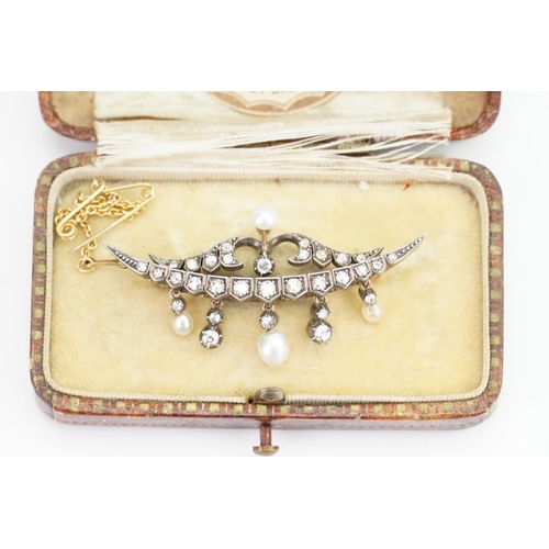 151 - A Victorian 9ct Gold and Silver topped brooch with 31 diamonds and 4 pearls inset, set in a half moo... 