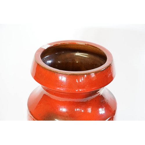 962 - A 1960s Red Glazed German Vase. Measuring: 47cms High.