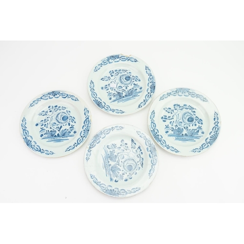 990 - A Set of Four Bristol blue and white tin glaze dinner plates decorated in the lettuce and tree patte... 