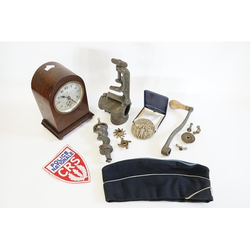 529 - A Table Mincer, a German Cased Bracket Clock, CRS Policeman's Hat, 1944 Drago Police Medal in Case, ... 