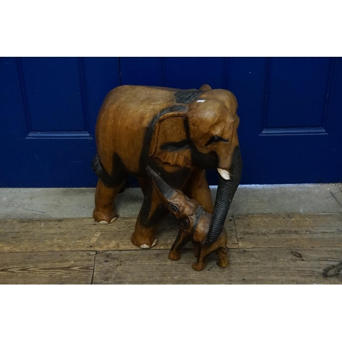 531 - An African Carved Hardwood study of an Elephant and her calf.