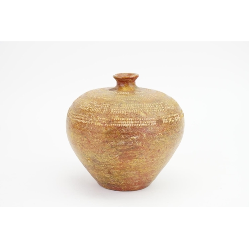 1001 - An interesting coil pot with incised decoration, possibly African.