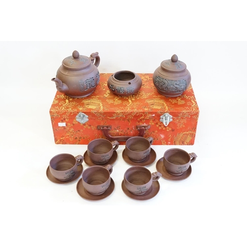 390 - A Chinese Ysing Tea Set consisting of Handled Tea Cups, Saucers, Teapot in Case.