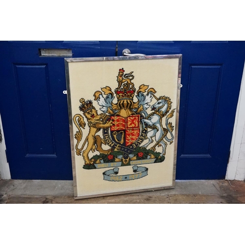 320 - A Silver Jubilee needlework depicting The Royal Coat of Arms with Latin verse in frame.