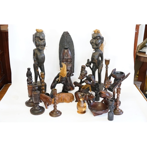 536 - A Collection of African Fetish Wood Figures, Face Masks,  Turned Candlesticks, Animal ornaments and ... 