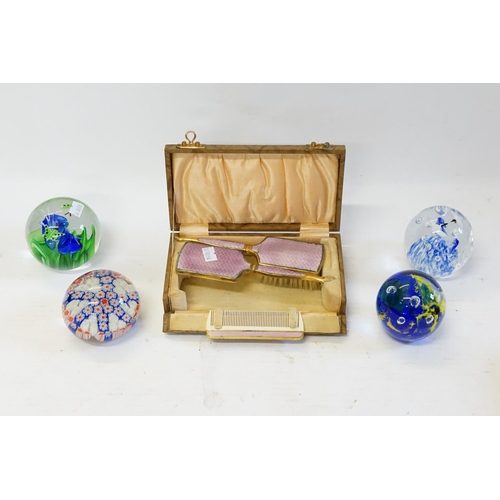 321 - A Modena design Glass Paper Weight, three others & a Gilt Metal three Piece Vanity Set in case.