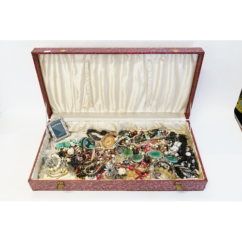 215 - A Red covered Jewellery box containing a large collection of costume Jewellery.