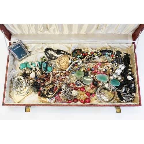 215 - A Red covered Jewellery box containing a large collection of costume Jewellery.