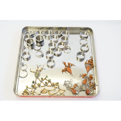 220 - A quantity of Steel and enamelled Rings with various designs.