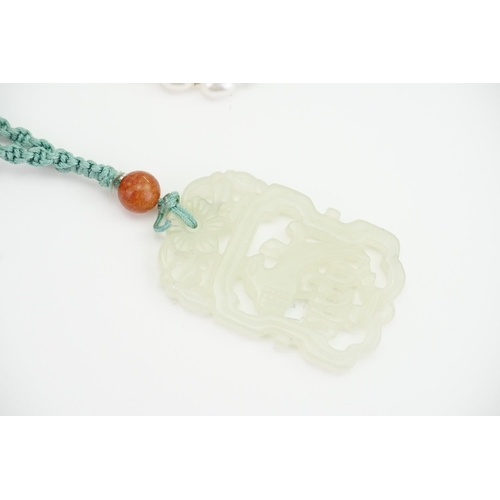 222 - A Chinese Carved Mutton Fat Necklace designed as birds, along with a pearl necklace.