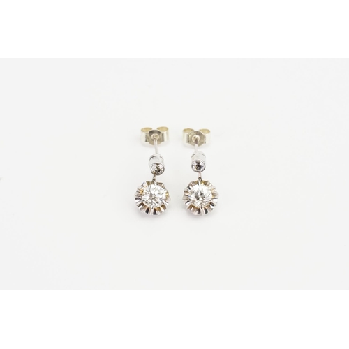 63 - A Pair of White metal Diamond Drop Earrings, Largest Diamond size approx: 0.5ct and Smallest approx:... 