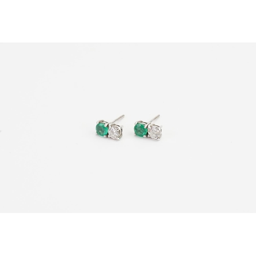 68 - A Pair of White Gold Diamond and Emerald set Earrings (0.2ct each). Weight approx: 1.6 grams.