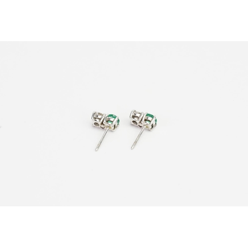 68 - A Pair of White Gold Diamond and Emerald set Earrings (0.2ct each). Weight approx: 1.6 grams.