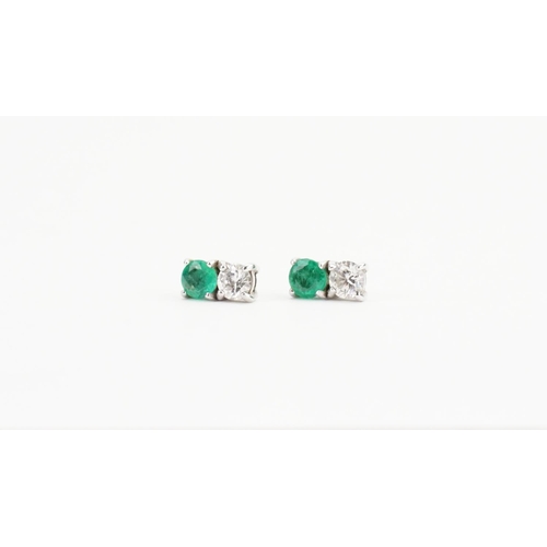 68 - A Pair of White Gold Diamond and Emerald set Earrings (0.2ct each). Weight approx: 1.6 grams.