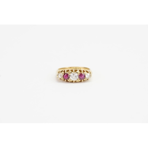 174 - An 18ct Gold Diamond and Ruby set Ring. Largest Diamond size approx: 0.4ct. Smaller Diamonds approx:... 