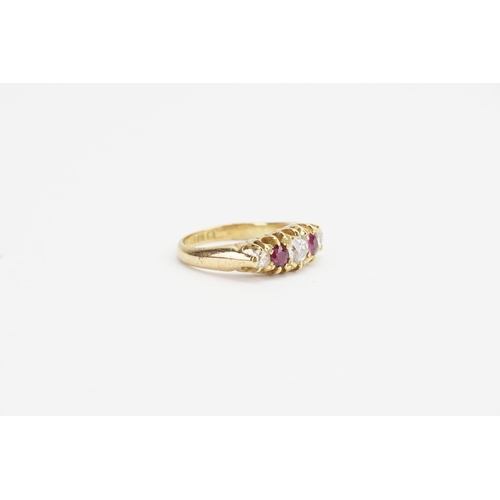 174 - An 18ct Gold Diamond and Ruby set Ring. Largest Diamond size approx: 0.4ct. Smaller Diamonds approx:... 