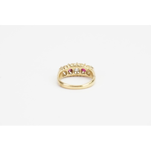 174 - An 18ct Gold Diamond and Ruby set Ring. Largest Diamond size approx: 0.4ct. Smaller Diamonds approx:... 