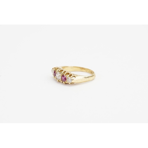 174 - An 18ct Gold Diamond and Ruby set Ring. Largest Diamond size approx: 0.4ct. Smaller Diamonds approx:... 