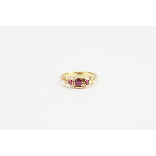 175 - An 18ct Gold Ruby and Diamond set Ring, set with Three Rubies, Largest approx: 0.3ct. Smallest 0.05c... 