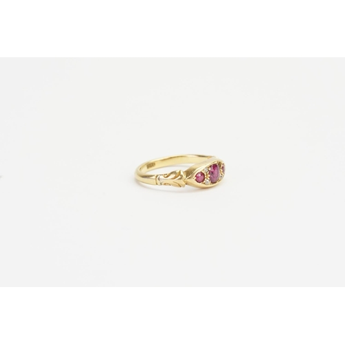 175 - An 18ct Gold Ruby and Diamond set Ring, set with Three Rubies, Largest approx: 0.3ct. Smallest 0.05c... 