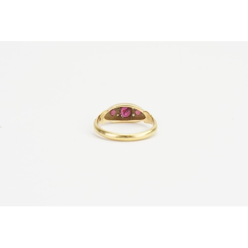 175 - An 18ct Gold Ruby and Diamond set Ring, set with Three Rubies, Largest approx: 0.3ct. Smallest 0.05c... 