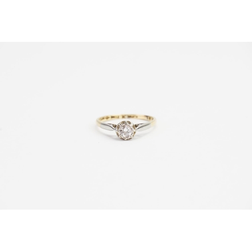 64 - An 18ct Gold and Platinum set Diamond Ring, Illusion set, 0.20ct Diamond size. Ring size: o.