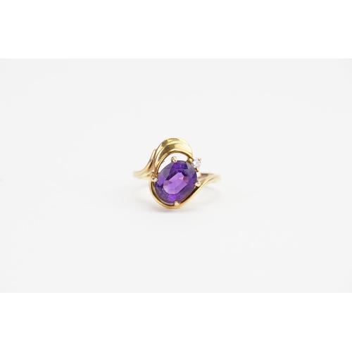 157 - A 14ct Gold Amethyst (2ct) and Diamond set Ring. Ring Size: O. Weighing: 5.4 grams.