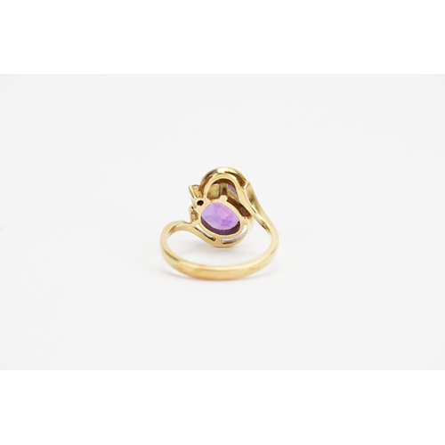 157 - A 14ct Gold Amethyst (2ct) and Diamond set Ring. Ring Size: O. Weighing: 5.4 grams.