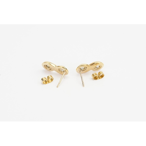 71 - A Pair of Yellow Gold Eternity style Earrings set with two Diamonds in each (0.15ct each). Measuring... 