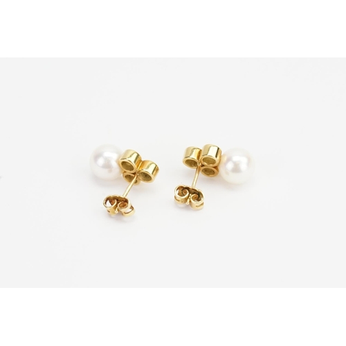 75 - A Pair of 18ct Gold Three Stone Diamond (0.1ct each) and Pearl Earrings in the drop design. Weighing... 