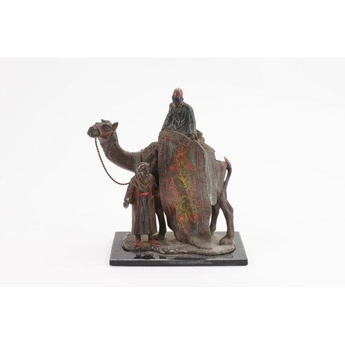 256 - A Spelter Table Lighter designed as a Camel with Attendants.