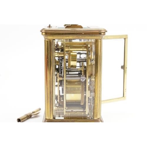 223 - A Brass Four Plate French Design Carriage Clock with alarm & Chiming Movement with a White enamelled... 