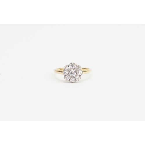 74 - A Victorian Old Cut Cluster Diamond Ring with a Central Stone and Eight Diamonds.