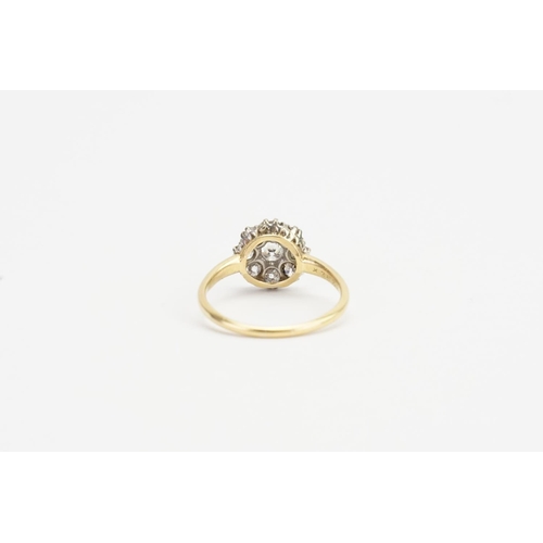 74 - A Victorian Old Cut Cluster Diamond Ring with a Central Stone and Eight Diamonds.