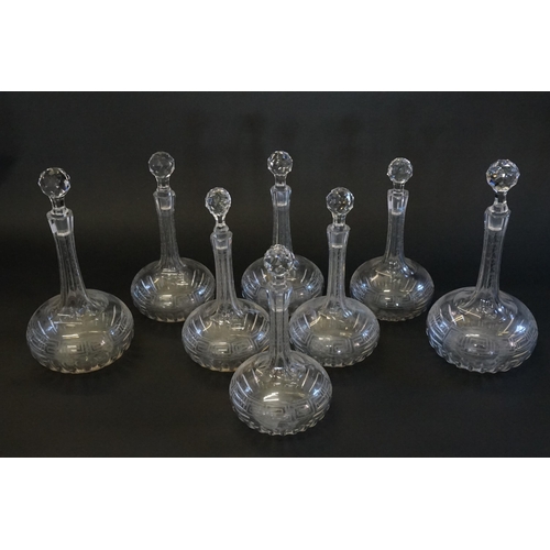 280 - A Set of Greek Key Engraved Sherry Decanters with Stoppers. (6 Small and 2 large).